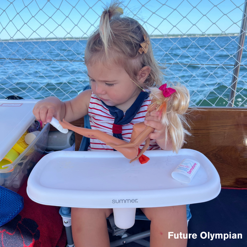 Baby and Barbie applying sunscreen