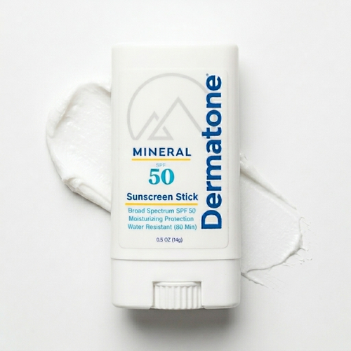 a sunscreen stick with a swatch of the product behind it