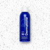 A bottle of the Dermatone sport sunscreen spray, surrounded by droplets on a white background